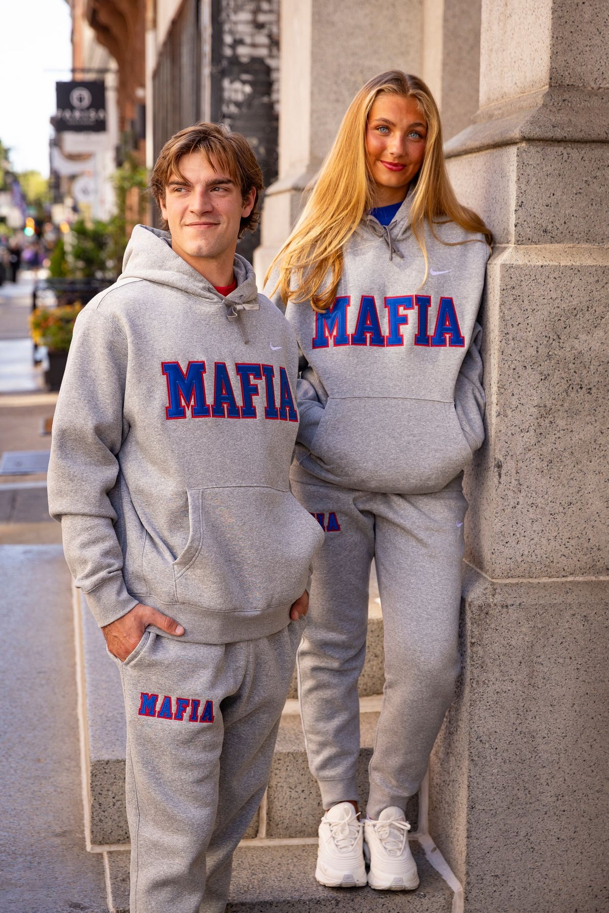 Male and female models wearing grey MAFIA hoodies
