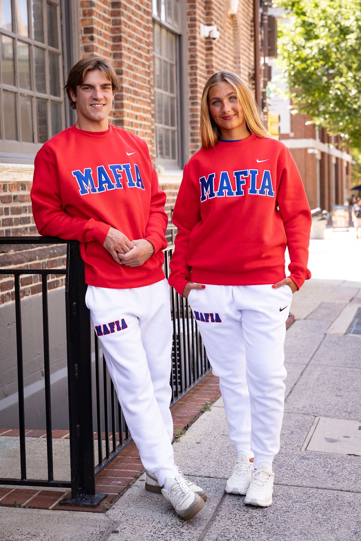 Male and female models wearing red MAFIA crewnecks
