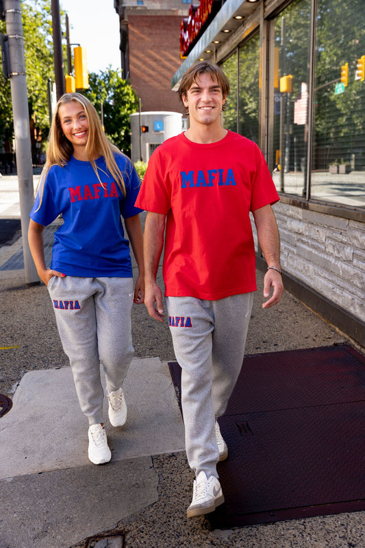 Models wearing grey MAFIA joggers with sewn-on lettering