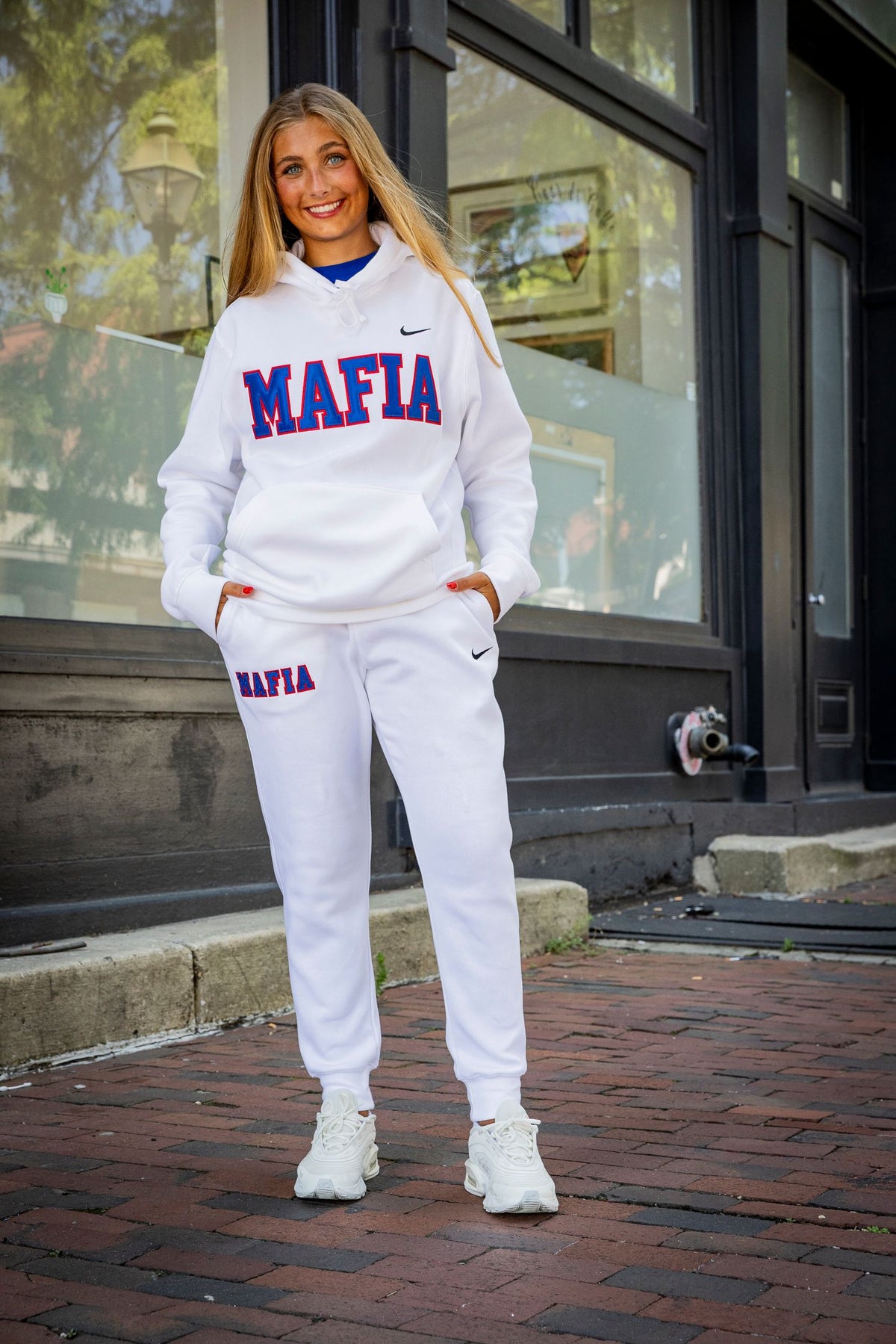 Outdoor model shot wearing white MAFIA joggers