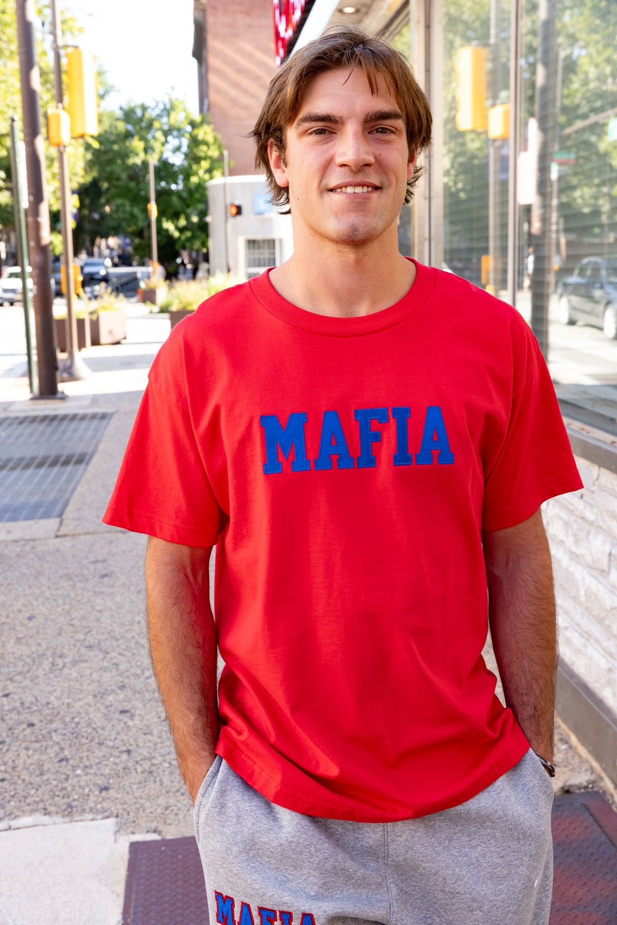 Male model wearing red MAFIA t-shirt with royal sewn-on lettering