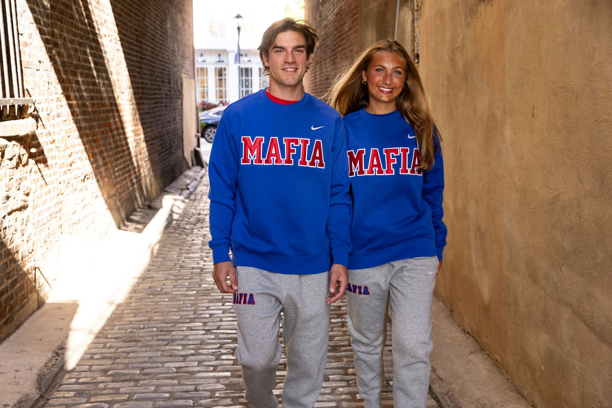 Male and female models wearing royal blue MAFIA crewnecks